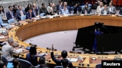 Members of the UN Security Council vote on a resolution by Russia and China to delay reimposition of sanctions on Iran. The resolution failed. 