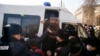 KAZAKHSTAN-POLITICS-VOTE - Law enforcement officers detain opposition supporters during a rally on the day of Kazakhstan's parliamentary election in Almaty on January 10, 2021. (Photo by Ruslan PRYANIKOV / AFP)
