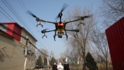 Распыление дезинфицирующих средств при помощи дрона в населенном пункте в китайской провинции Хэбэй. 31 января 2020 года.