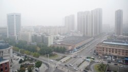 Ухань и вид на городской рынок, откуда, как считается, началось распространение нового коронавируса. 11 декабря 2020 года.
