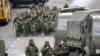 Власти продемонстрировали оппозиции избитого толпой спецназовца, отставшего от своих