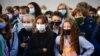 FRANCE -- Pupils wearing protective masks stand as they listen to a woman (unseen) at Françoise-Giroud middle school in Vincennes, east of Paris, on September 1, 2020,