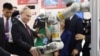 Владимир Путин в ходе визита в Китай посещает выставку технических разработок Харбинского технологического института, 2024 год
